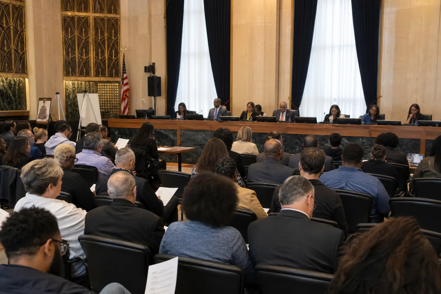Residents and public officials participating in a local government meeting